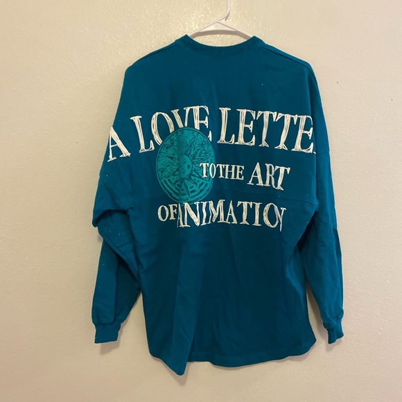 Disney Tops - Disney Cirque du Soleil Glittery Teal Long Sleeve Spirit Jersey
